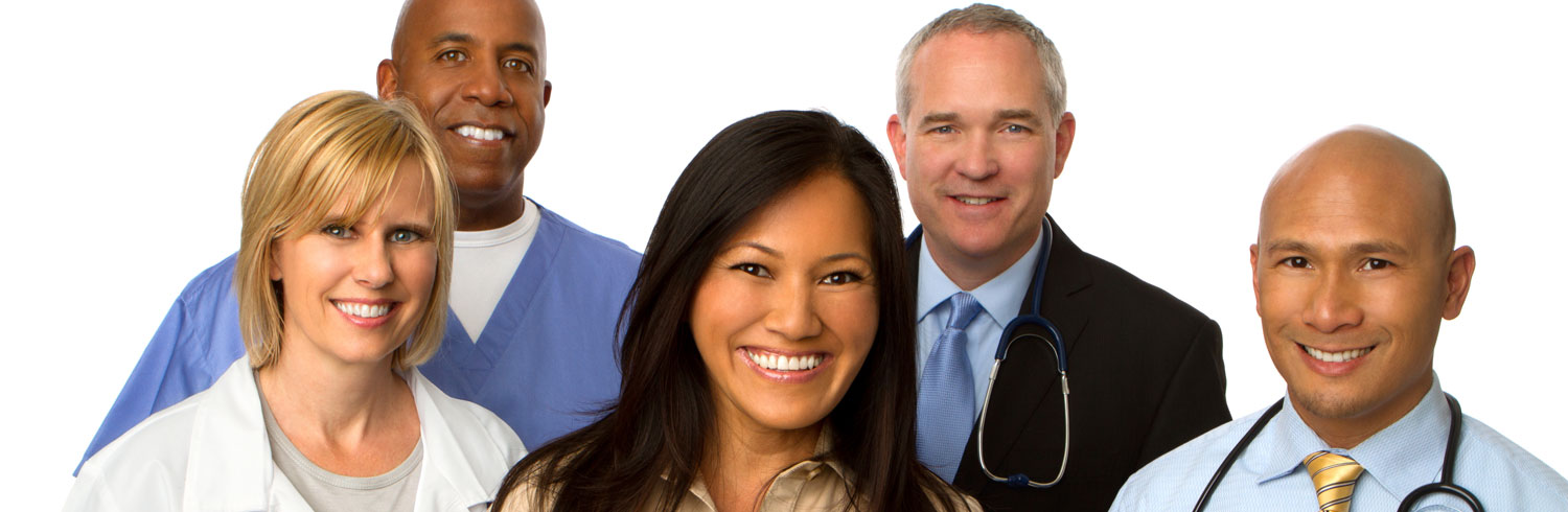 Five healthcare professionals smiling together.